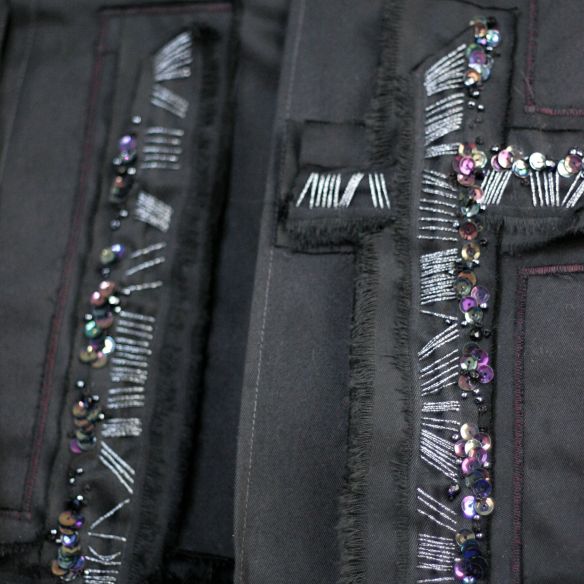 embroidered-by-hand black pleated kilt